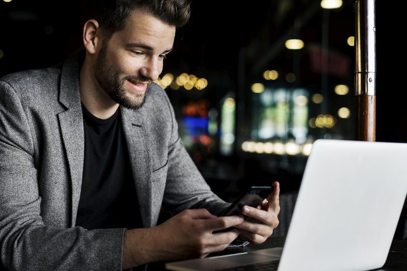 Businessman using business phone system